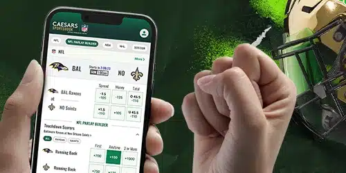 Caesars sportsbook showing hands holding a mobile on a green background with a helmet on the right.